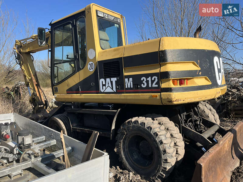 Колісний екскаватор Caterpillar M312 2001 в Косові
