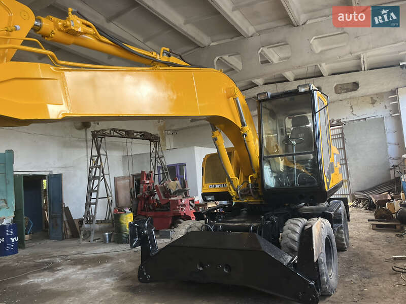 Колесный экскаватор Caterpillar 315 2001 в 