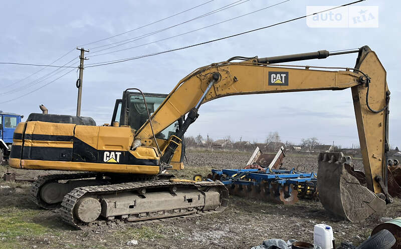 Экскаватор погрузчик Caterpillar 320 1998 в 