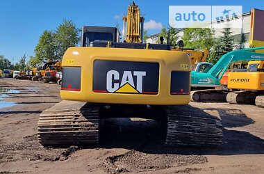 Гусеничный экскаватор Caterpillar 320 2009 в 