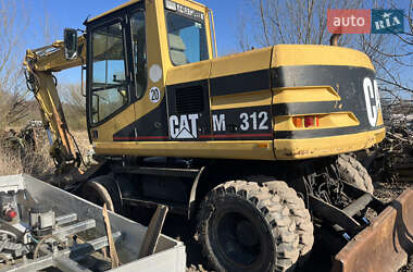 Колесный экскаватор Caterpillar M312 2001 в Косове