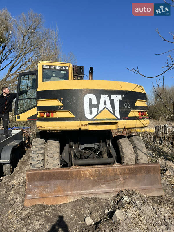 Колесный экскаватор Caterpillar M312 2001 в Косове