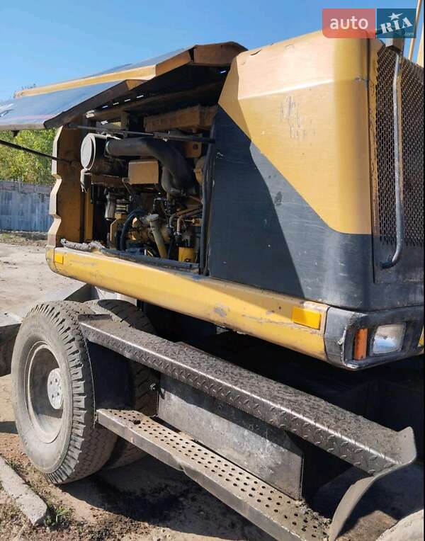 Екскаватор навантажувач Caterpillar M312 2002 в Житомирі