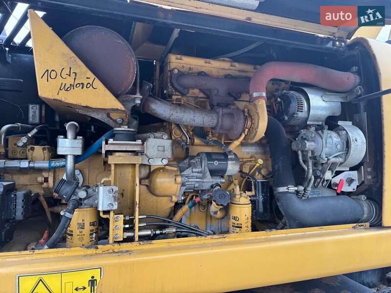 Колесный экскаватор Caterpillar M313 2012 в Долине
