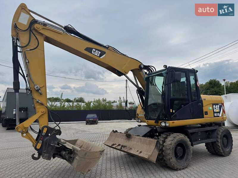 Колесный экскаватор Caterpillar M313 2012 в Долине