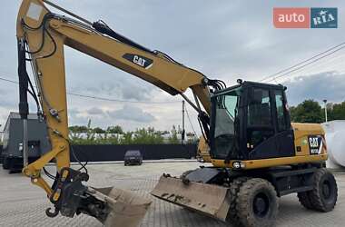 Колесный экскаватор Caterpillar M313 2012 в 