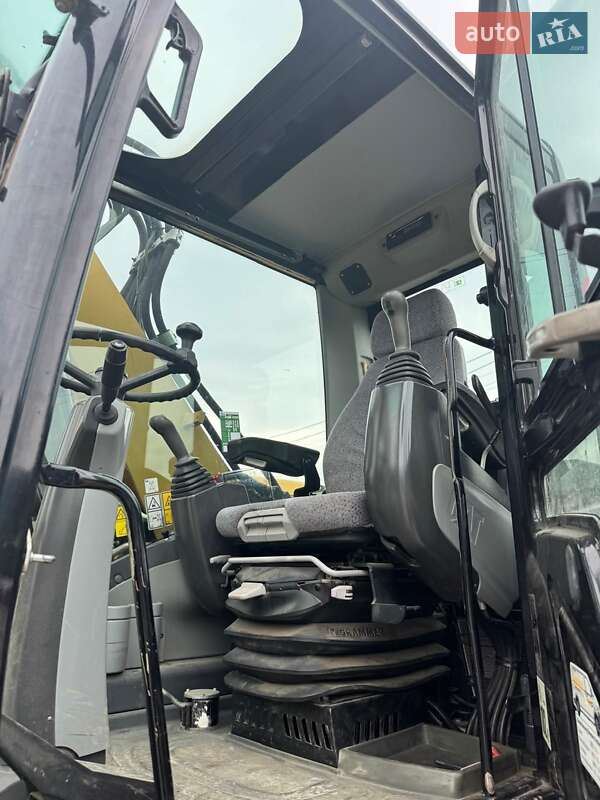 Колесный экскаватор Caterpillar M313 2012 в Долине