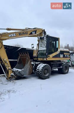 Екскаватор навантажувач Caterpillar M315 2002 в Сумах