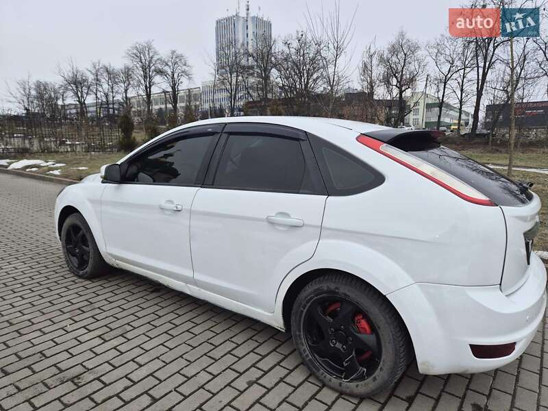 2010 Ford Focus, VIN KL1SF69YE7B068912:plate — фото 1 (autoria)