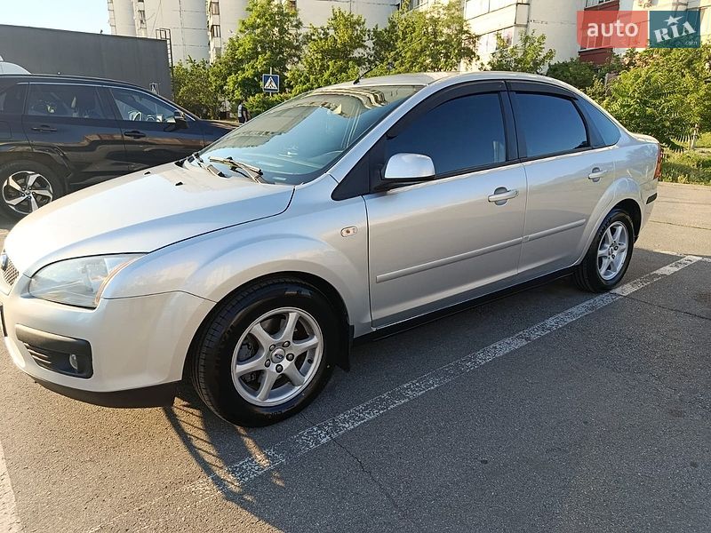2007 Ford Focus, VIN WF04XXWPD47P23564:plate — фото 1 (autoria)