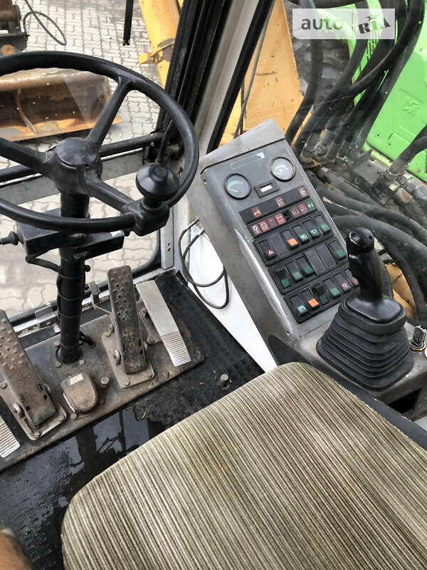 Колесный экскаватор Liebherr 311 1996 в Калуше