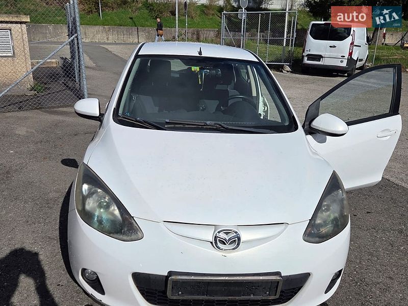 2009 Mazda 2, VIN JMZDE145500211599:plate — фото 1 (autoria)