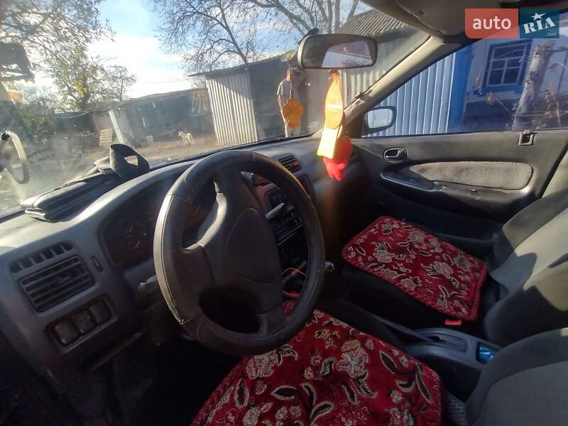 Седан Mazda 323 1997 в Христинівці фото 4 Седан Mazda 323 1997 в Христинівці