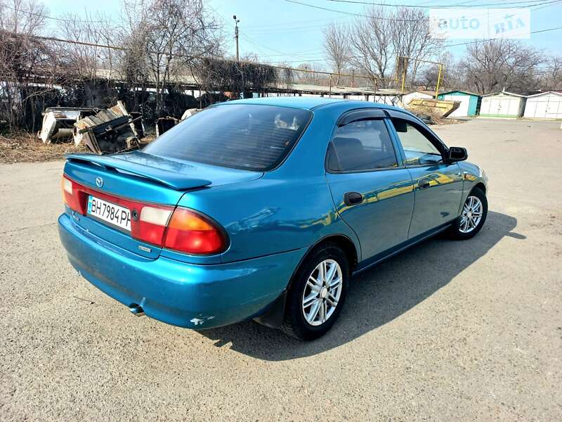 Седан Mazda 323 1998 в Одесі фото 9 Седан Mazda 323 1998 в Одесі