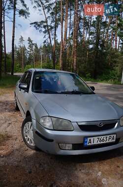 Седан Mazda 323 1999 в Обухові