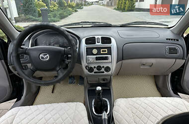 Хэтчбек Mazda 323 2003 в 