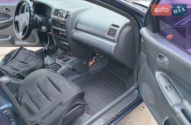 Седан Mazda 323 1998 в  фото 11 Седан Mazda 323 1998 в