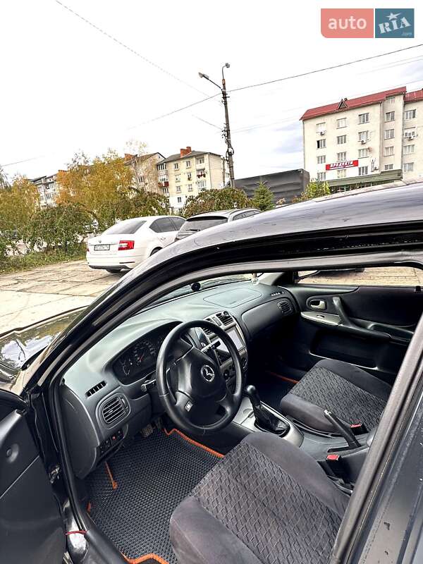 Хетчбек Mazda 323 2001 в Самборі фото 17 Хетчбек Mazda 323 2001 в Самборі