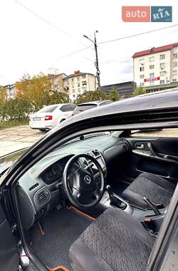Хэтчбек Mazda 323 2001 в  фото 17 Хэтчбек Mazda 323 2001 в