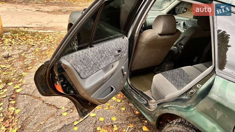 Хетчбек Mazda 323 1999 в Києві фото 10 Хетчбек Mazda 323 1999 в Києві
