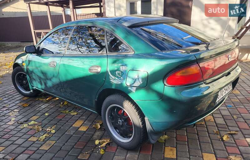Хетчбек Mazda 323 1998 в Подільську фото 2 Хетчбек Mazda 323 1998 в Подільську