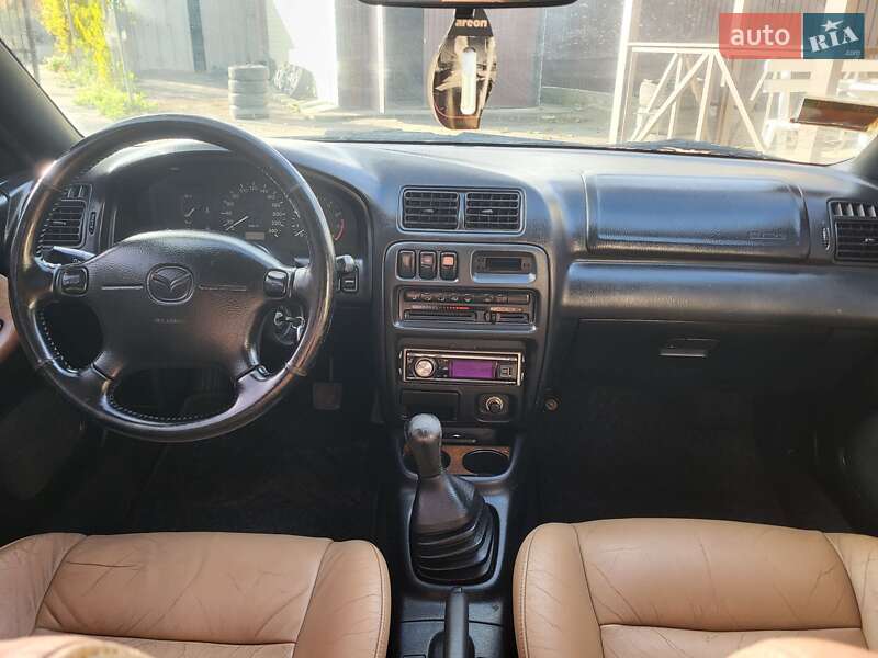 Хетчбек Mazda 323 1998 в Подільську фото 7 Хетчбек Mazda 323 1998 в Подільську