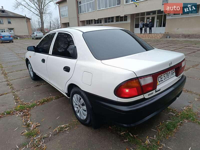 Седан Mazda 323 1998 в Чернівцях фото 12 Седан Mazda 323 1998 в Чернівцях