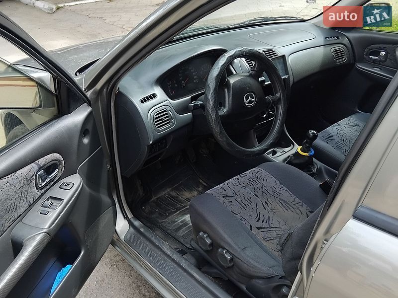 Хэтчбек Mazda 323 1999 в Затишье фото 4 Хэтчбек Mazda 323 1999 в Затишье