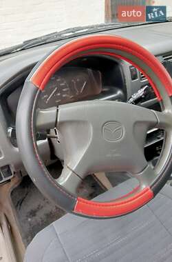 Хэтчбек Mazda Demio 1999 в 