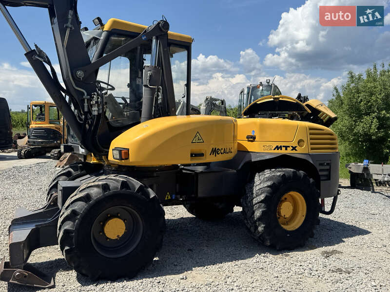 Колесный экскаватор Mecalac 12MXT 2010 в 