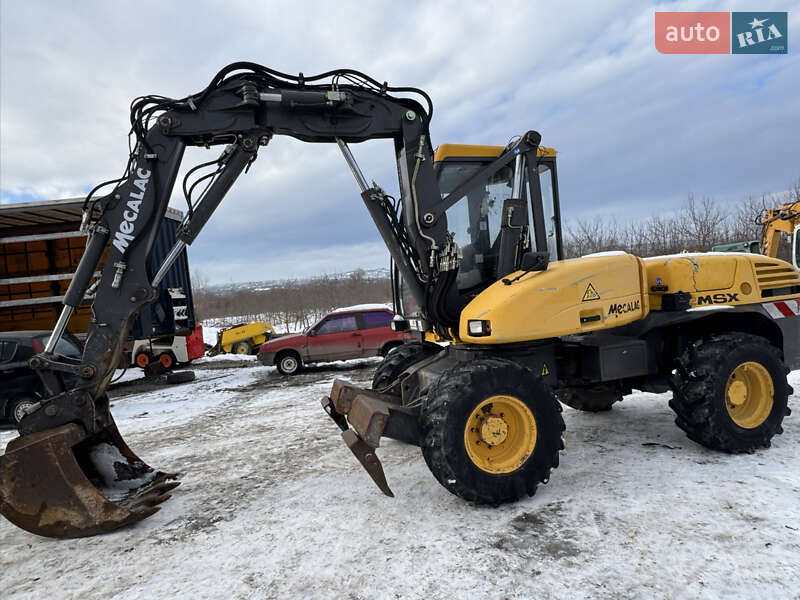 Колесный экскаватор Mecalac 12MXT 2006 в Недобоевцах