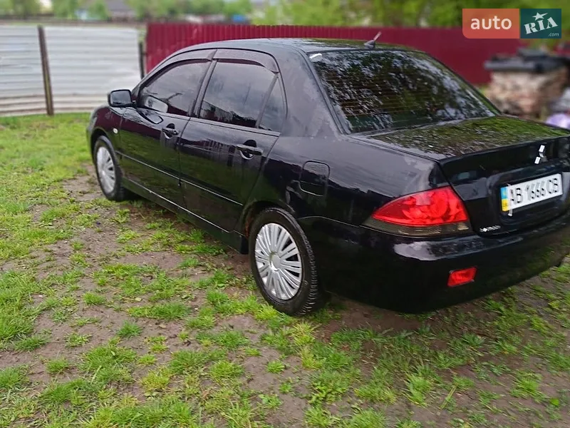 Mitsubishi Lancer 2008 VIN JMBSNCS3A8U004735 фото оголошення 5 з 37