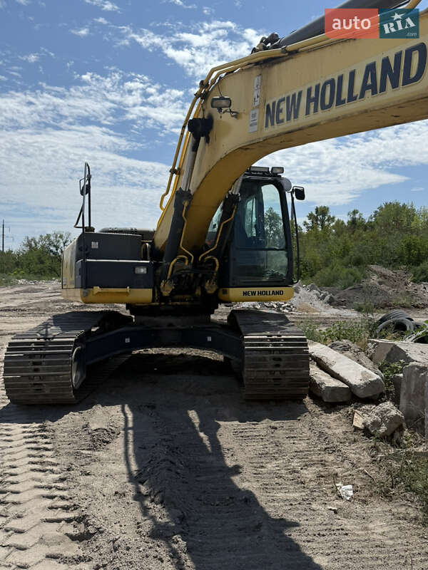 Екскаватор навантажувач New Holland E 305 2013 в 