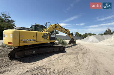 Екскаватор навантажувач New Holland E 305 2013 в 