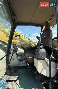 Екскаватор навантажувач New Holland E 305 2013 в 