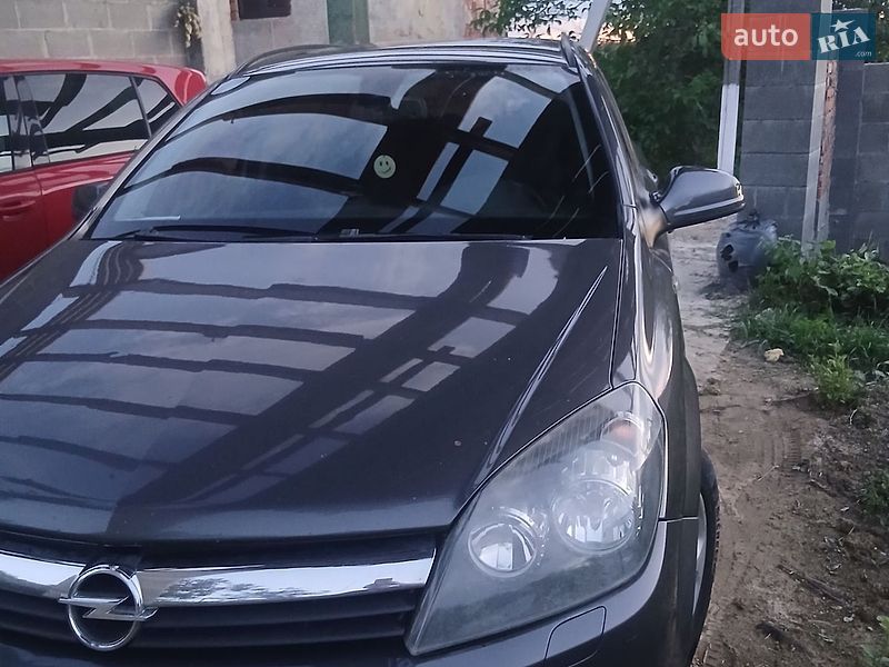 2010 Opel Astra, VIN W0L0AHL35B2054100:plate — фото 1 (autoria)