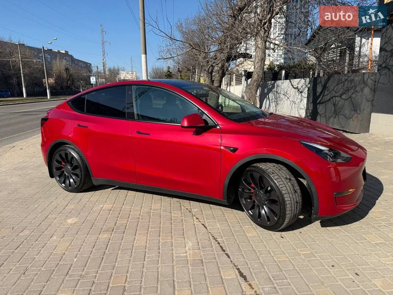 2023 Tesla Model Y, VIN 7SAYGDEF1PF661067:plate — фото 1 (autoria)