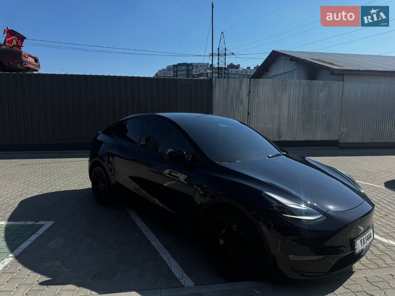 2024 Tesla Model Y, VIN 7SAYGDEE8RA229390:plate — фото 1 (autoria)