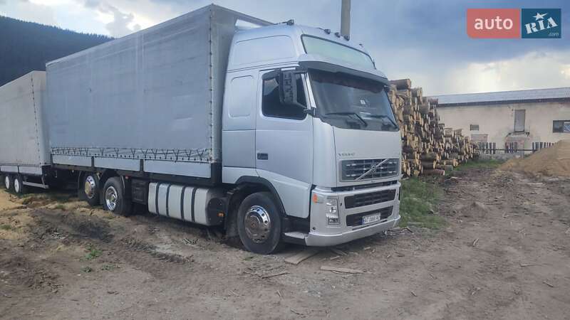 Тентованый Volvo FH 12 2002 в  фото Тентованый Volvo FH 12 2002 в